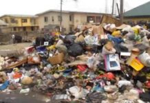 RESIDENTS DECRY WEEK-LONG DELAY IN REFUSE COLLECTION